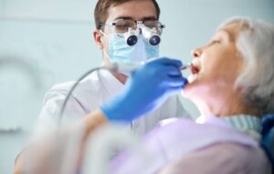 Dental procedure on elderly woman.