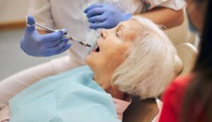 Dental procedure, elderly woman.