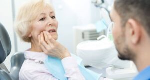 Elderly woman dental check up.