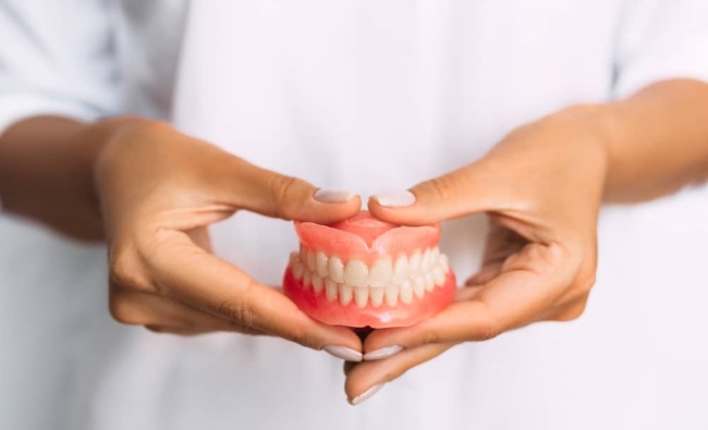 Cleaning false teeth is vital because your mouth is full of bacteria.